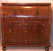 A mahogany roll top bureau after restoration