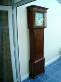 An oak longcase clock